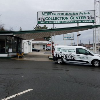 hazardous collection center with minivan parked in front