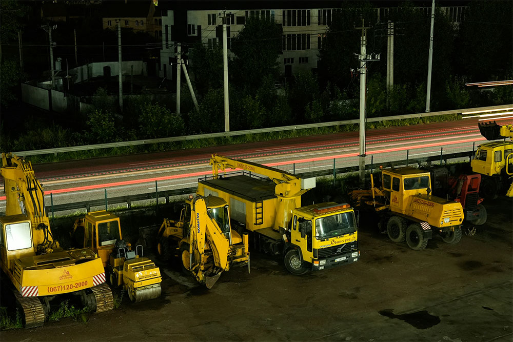 yellow trucks parked on construction site