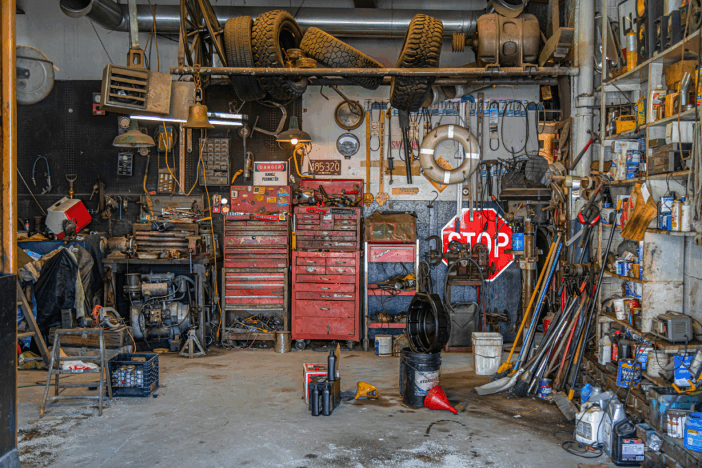 Garage with several equipment and fuel sills on the floor