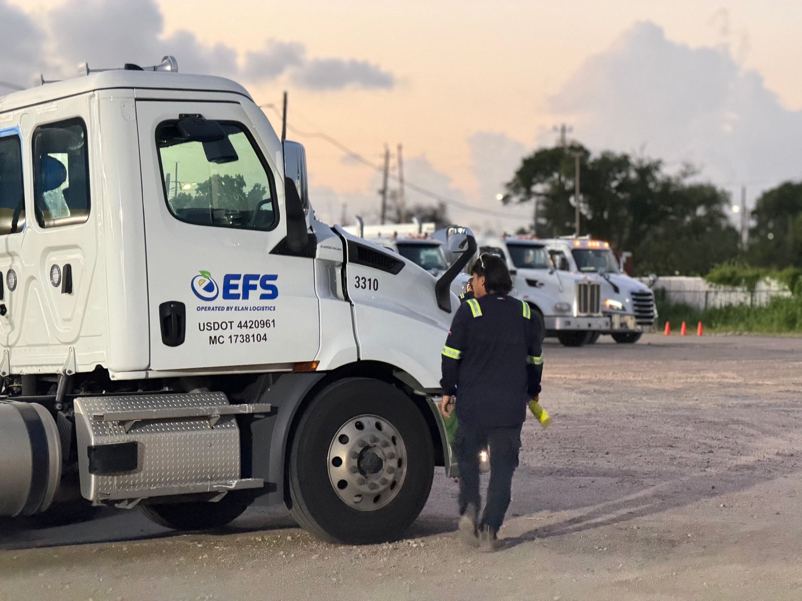 EFS-branded truck and a worker in the truck yard